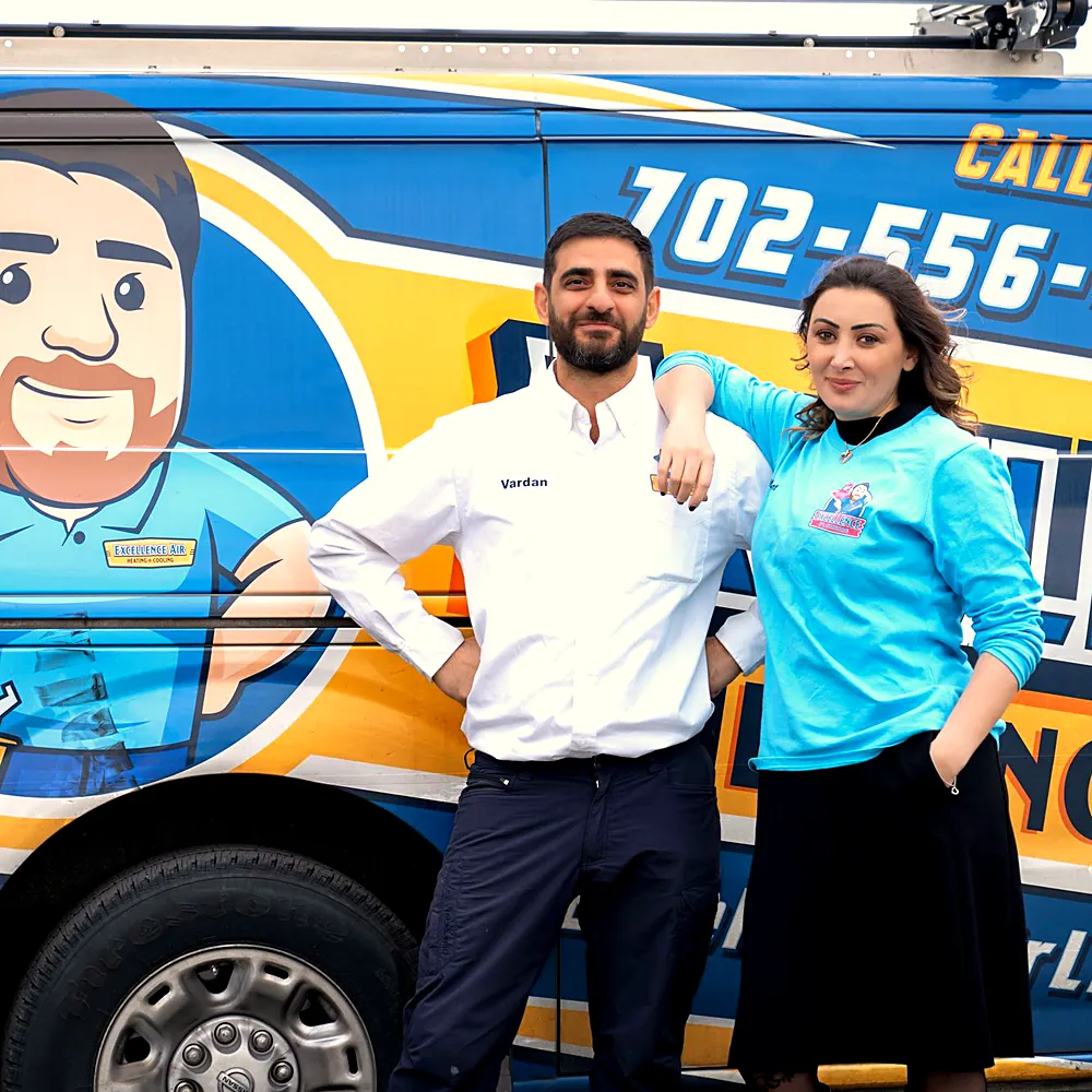 Owners of Excellence Air & Plumbing standing in front of a company van with the mascot